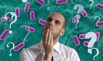 pink capsules green background man